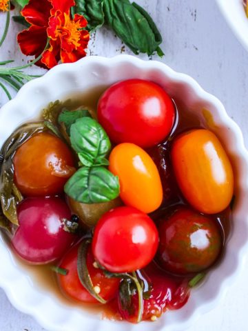 Fermented cherry tomatoes in a bowl.