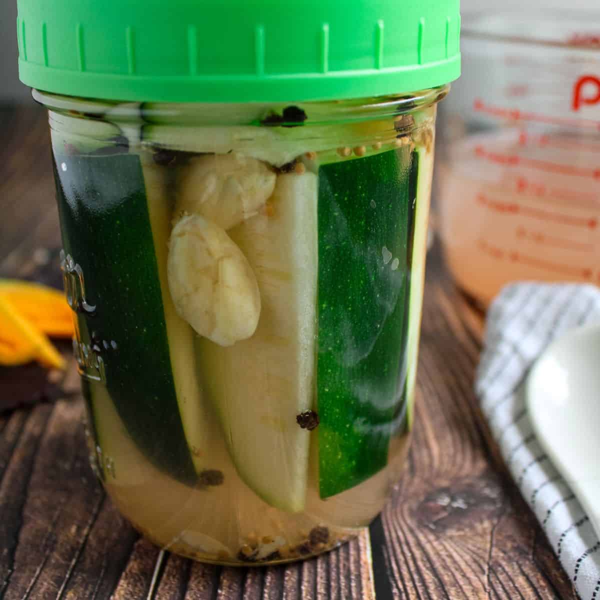 Fermened zucchini in a mason jar.