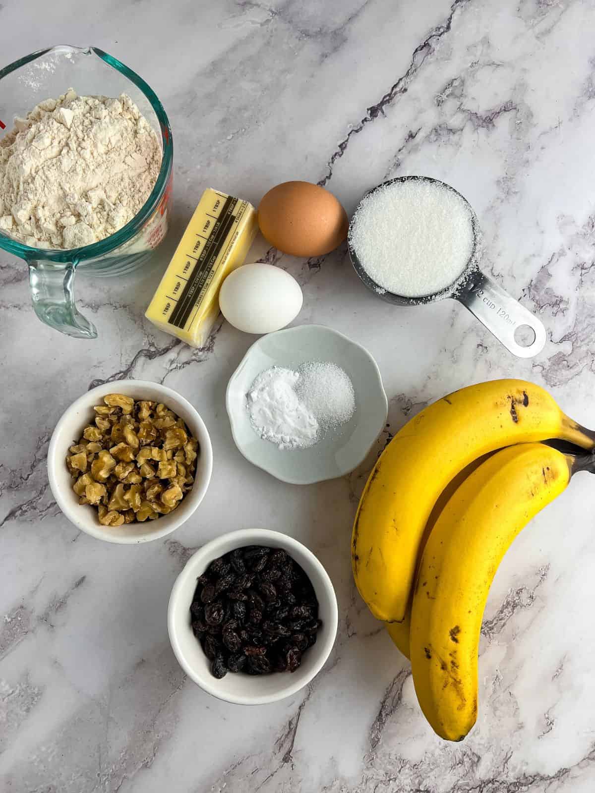 Ingredients for banana bread with walnut and raisin.