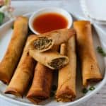 Finish dish of crispy pork lumpia in a table.