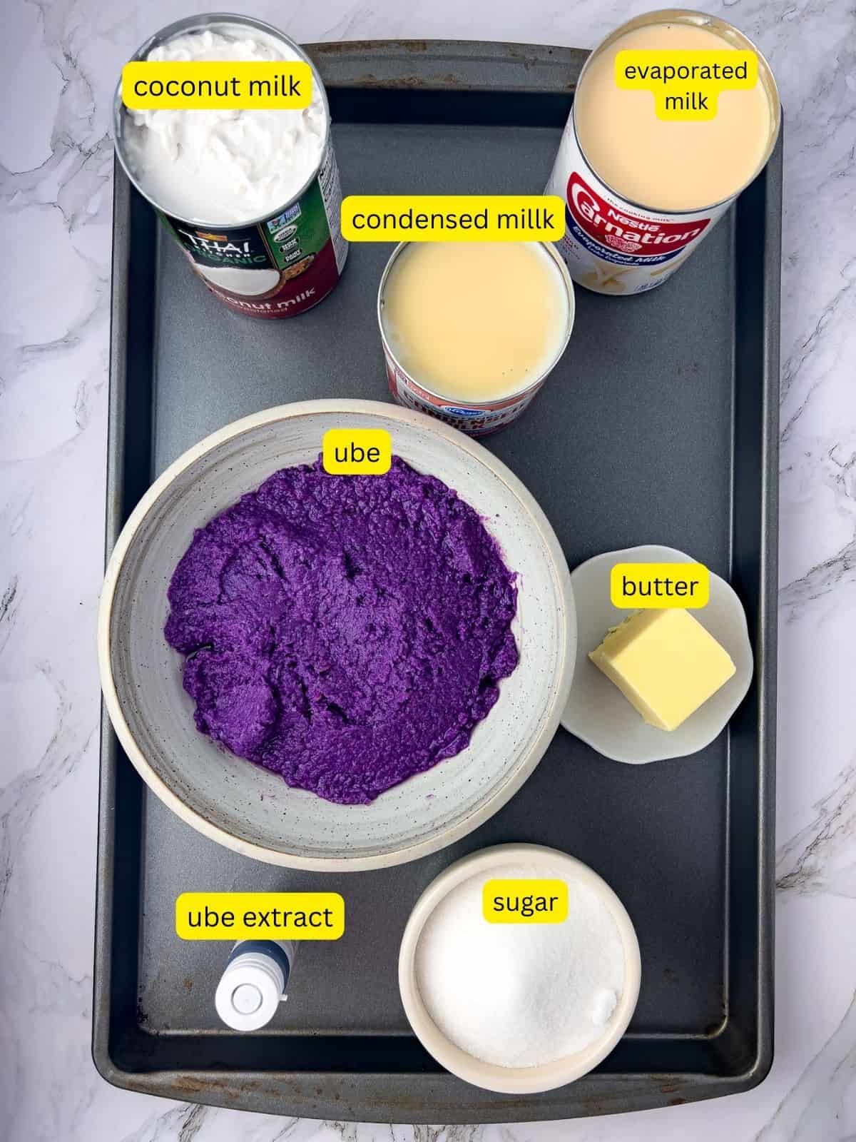 Ingredients for ube halaya jam recipe including butter, sugar, ube extract, condensed, evaporated and coconut milk.