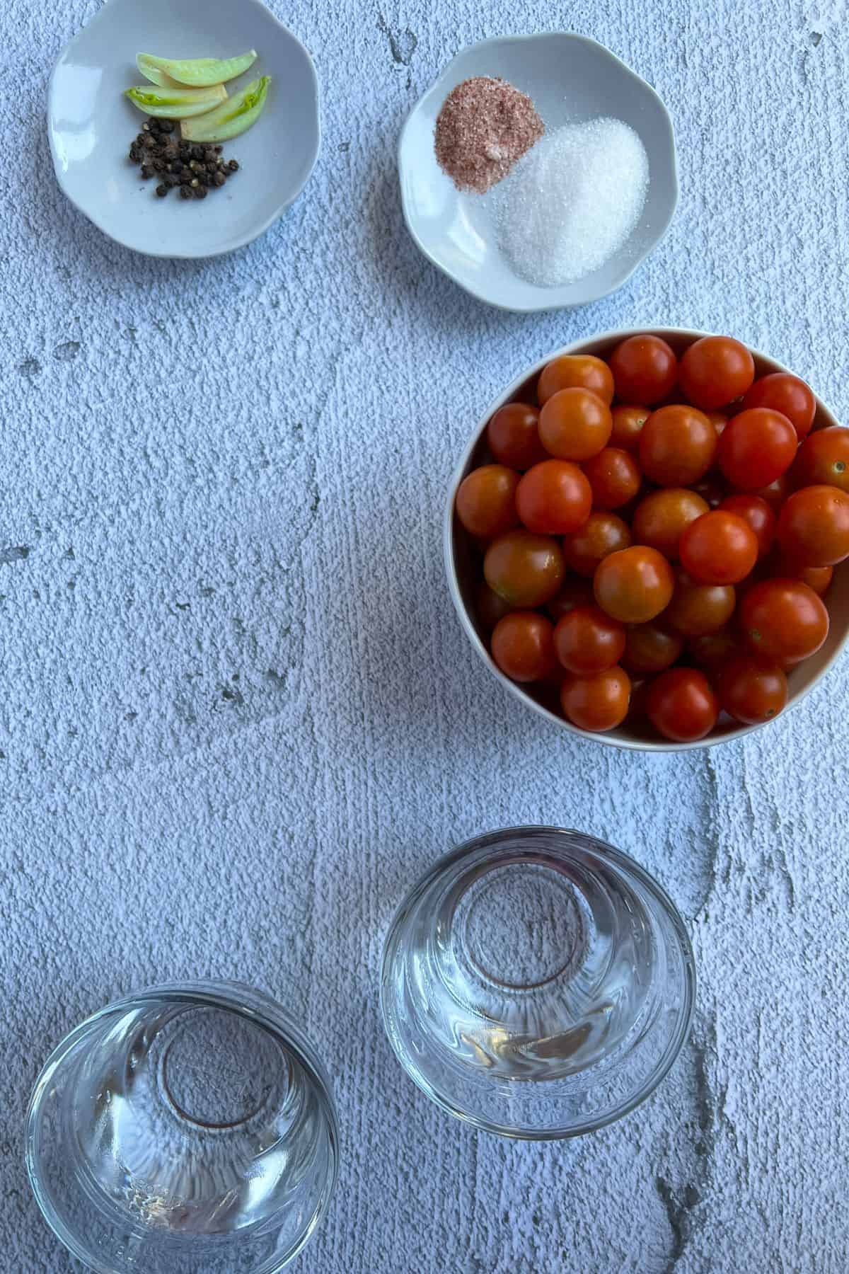 Ingredients lists for pickled tomatoes on the table.