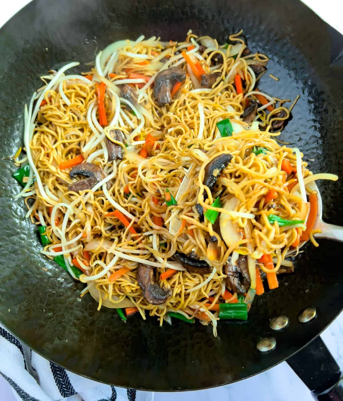 Finish cantonese chow mein noodles in a wok.