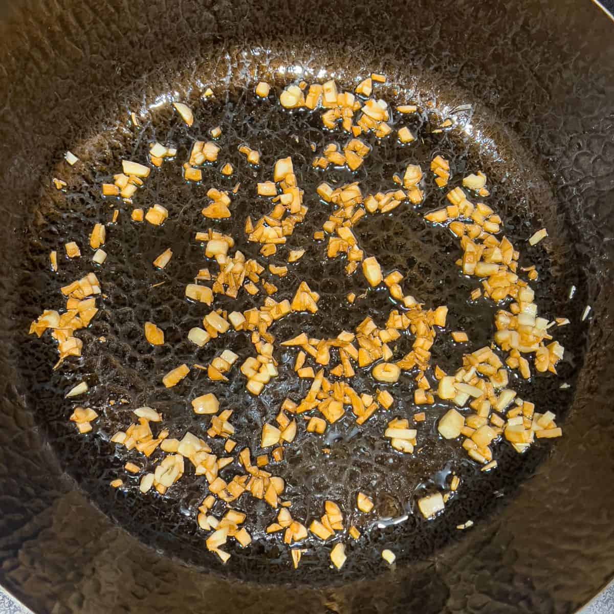 Toasted garlic in a wok.