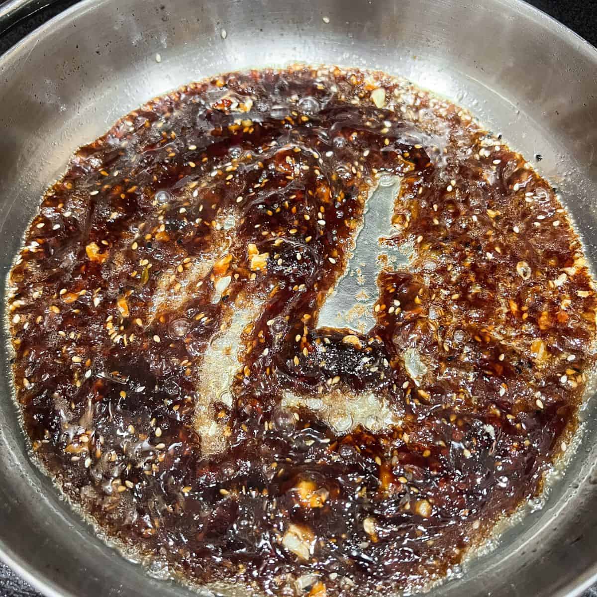 Sweet and sticky sauce in a skillet.