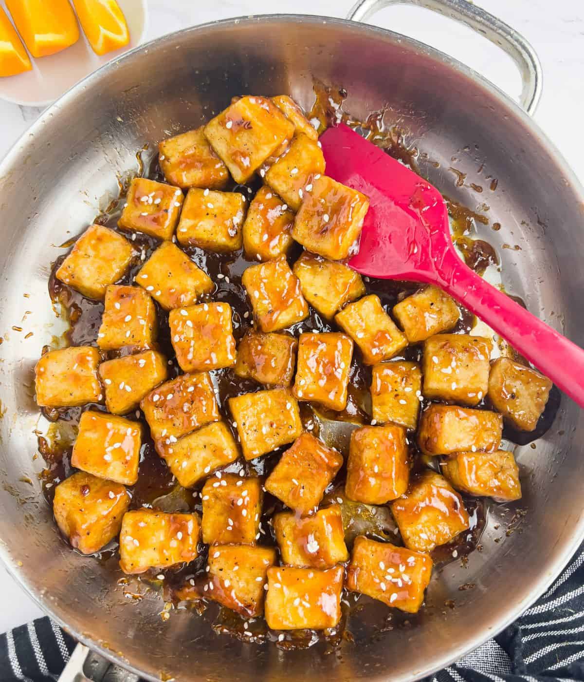 Finish dish of orange chicken tofu in skillet.