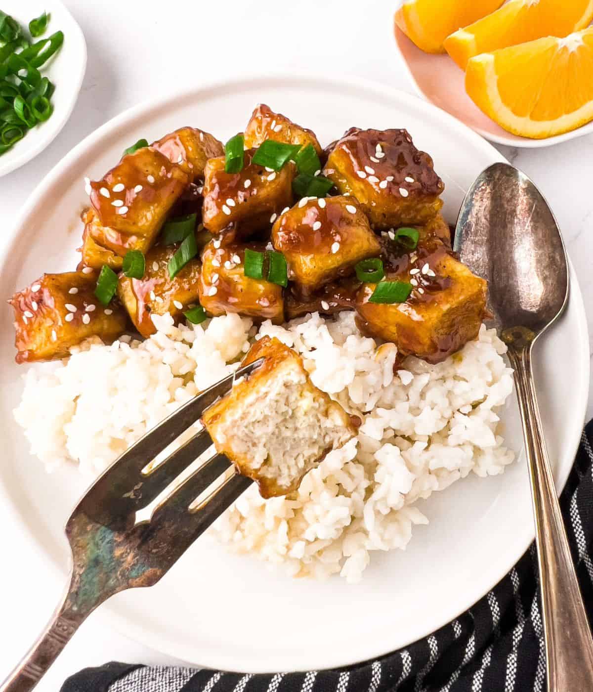 Finish dish of orange chicken tofu with a bite.