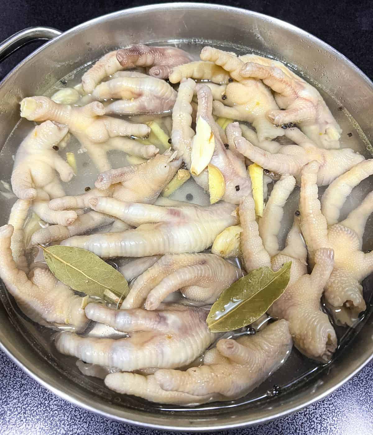 Boil the chicken feet to make it tender.
