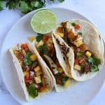Finish dish of blackened fish taco with pico de gallo.