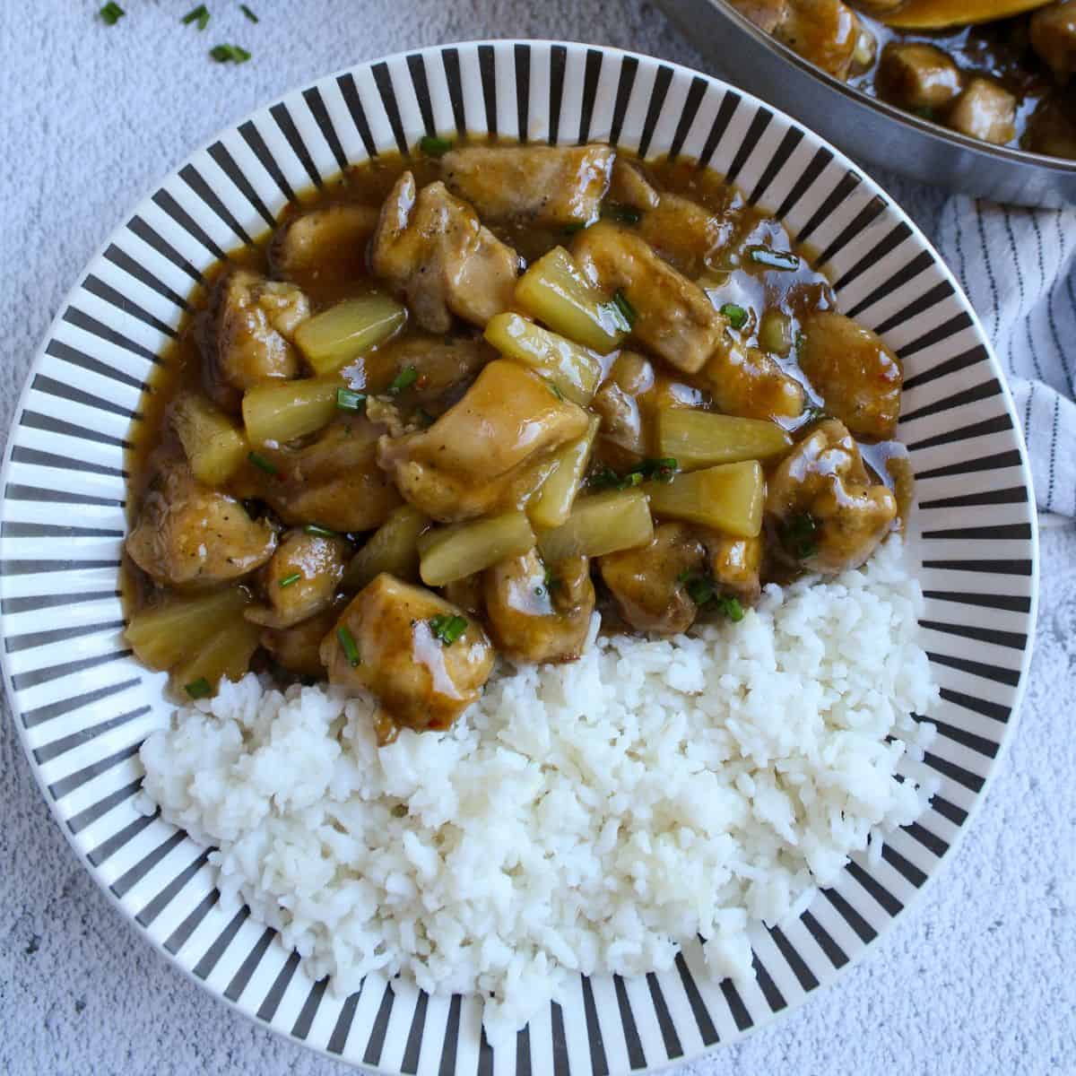 Glazed Pineapple Chicken In a plate serve with rice.