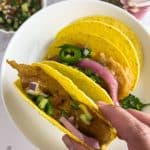 Finish dish of shrimp taco in a plate.