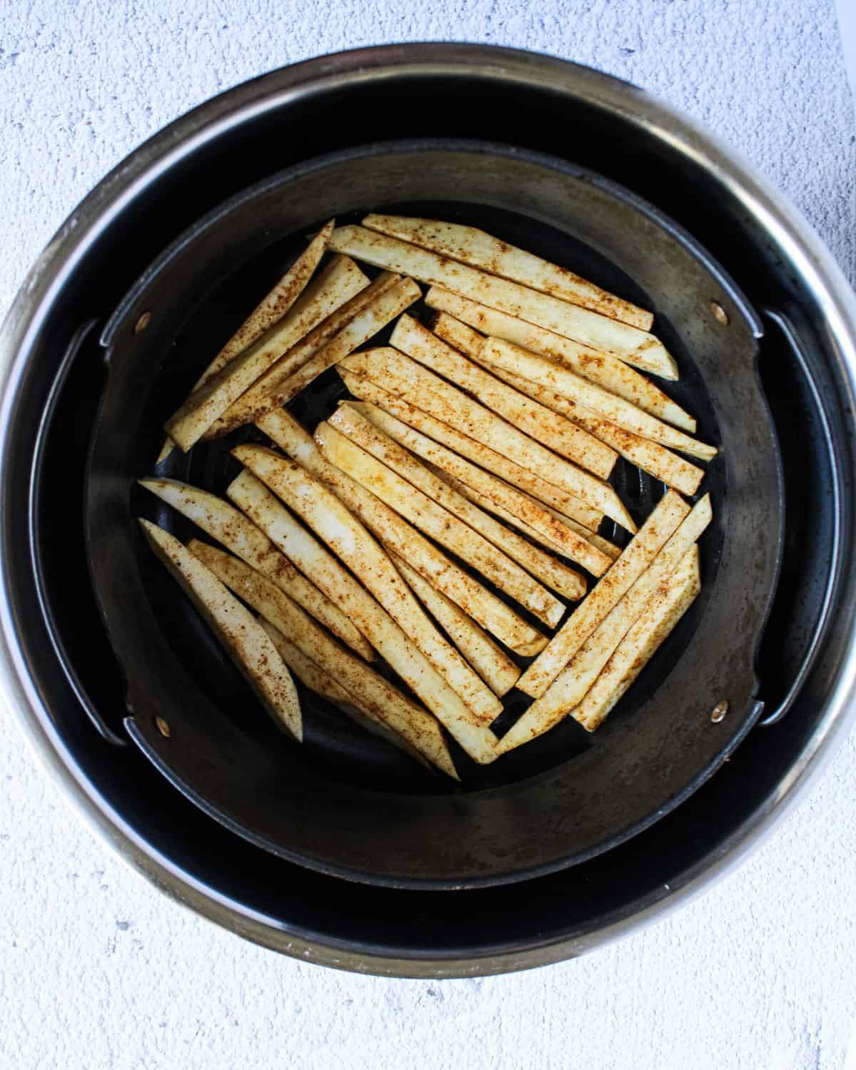 Sweet potato fries in the air-fryer basket.