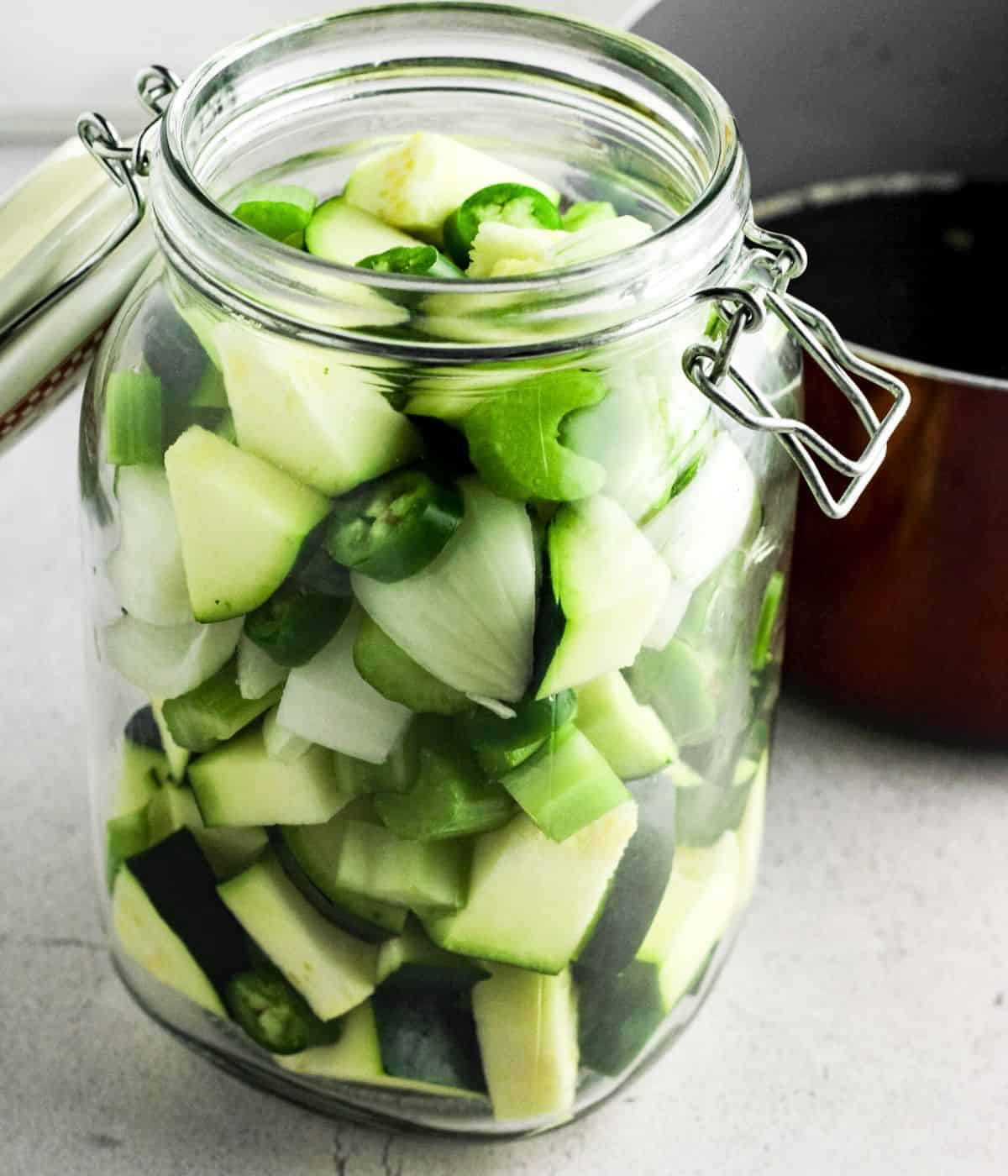 Chopped vegetable in a glass jar.