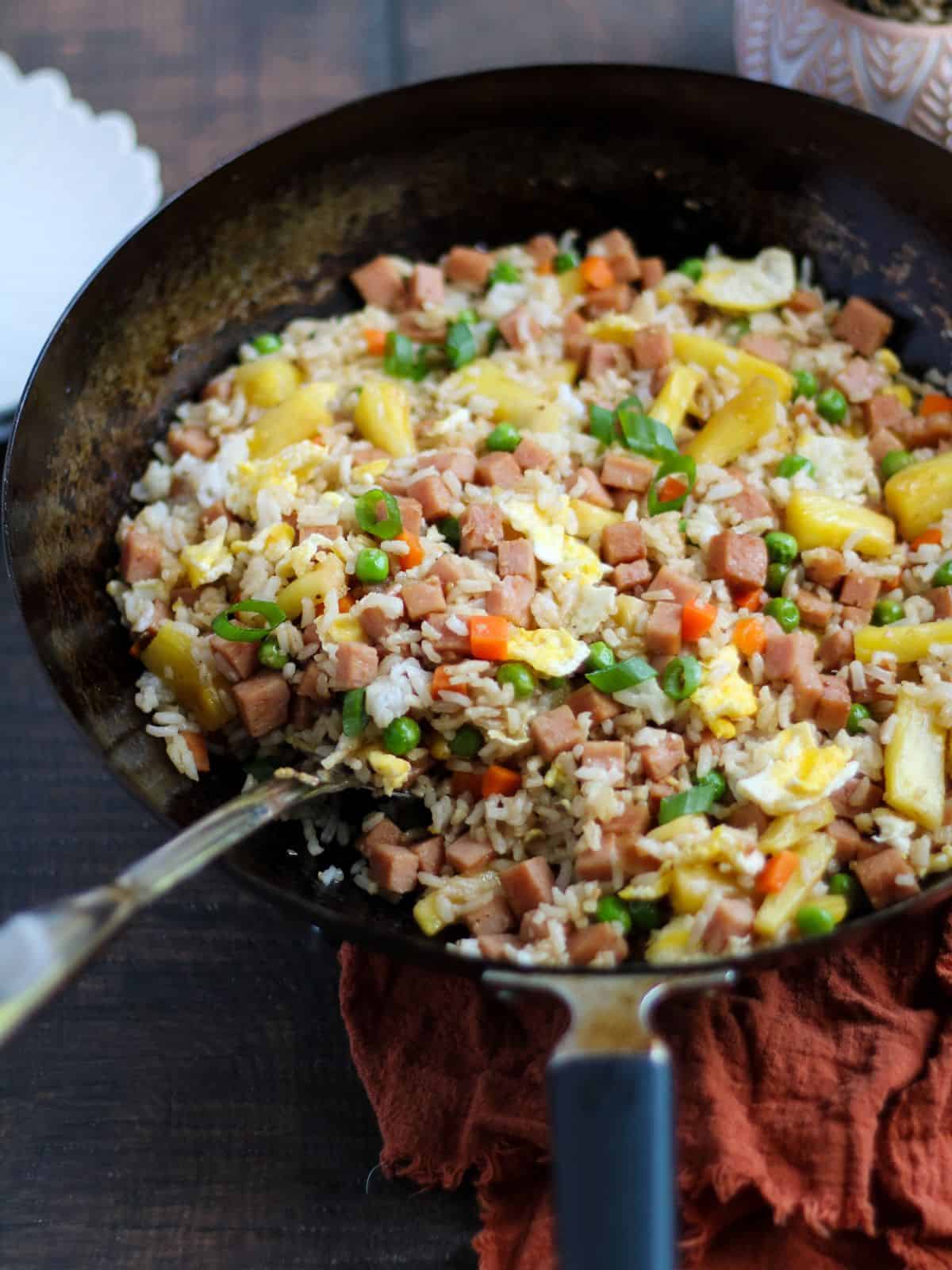 Cooked fried rice in a wok.