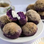 Finish dish of ube pandesal with cheese in a plate.