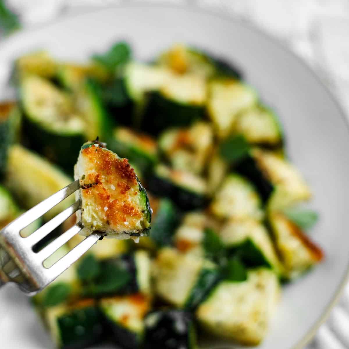 Roasted zucchini in a fork.
