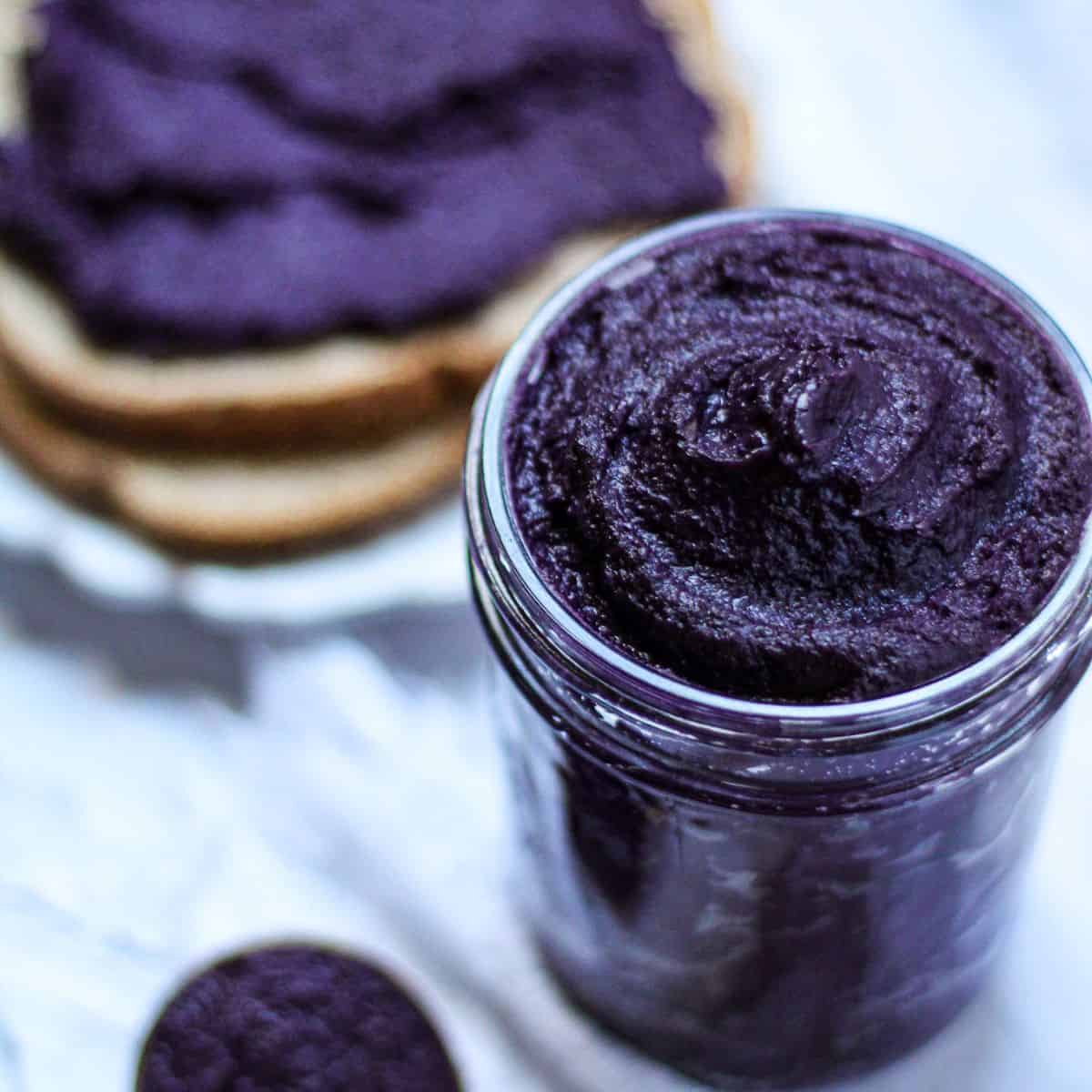 Ube halaya jam in a jar and spread in a toasted bread.