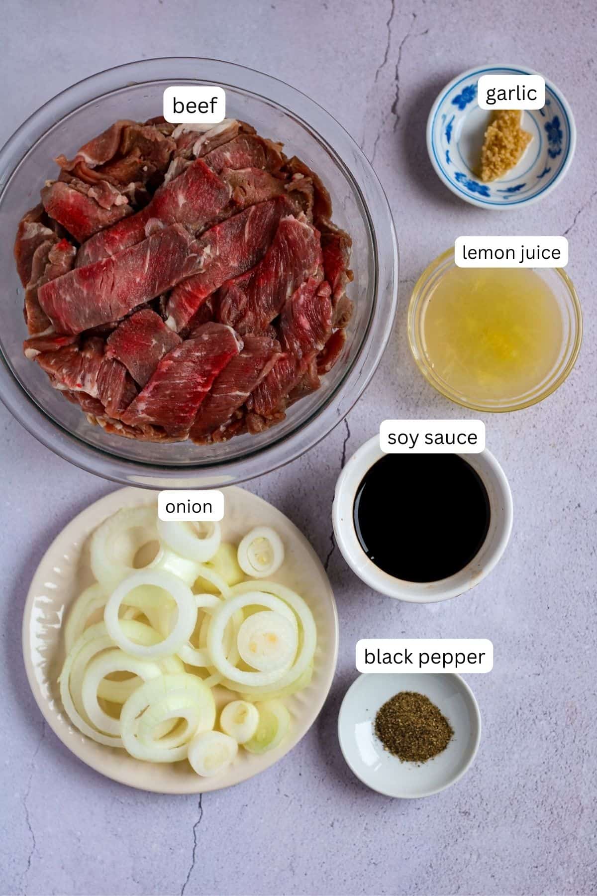 Ingredients for bistek tagalog.
