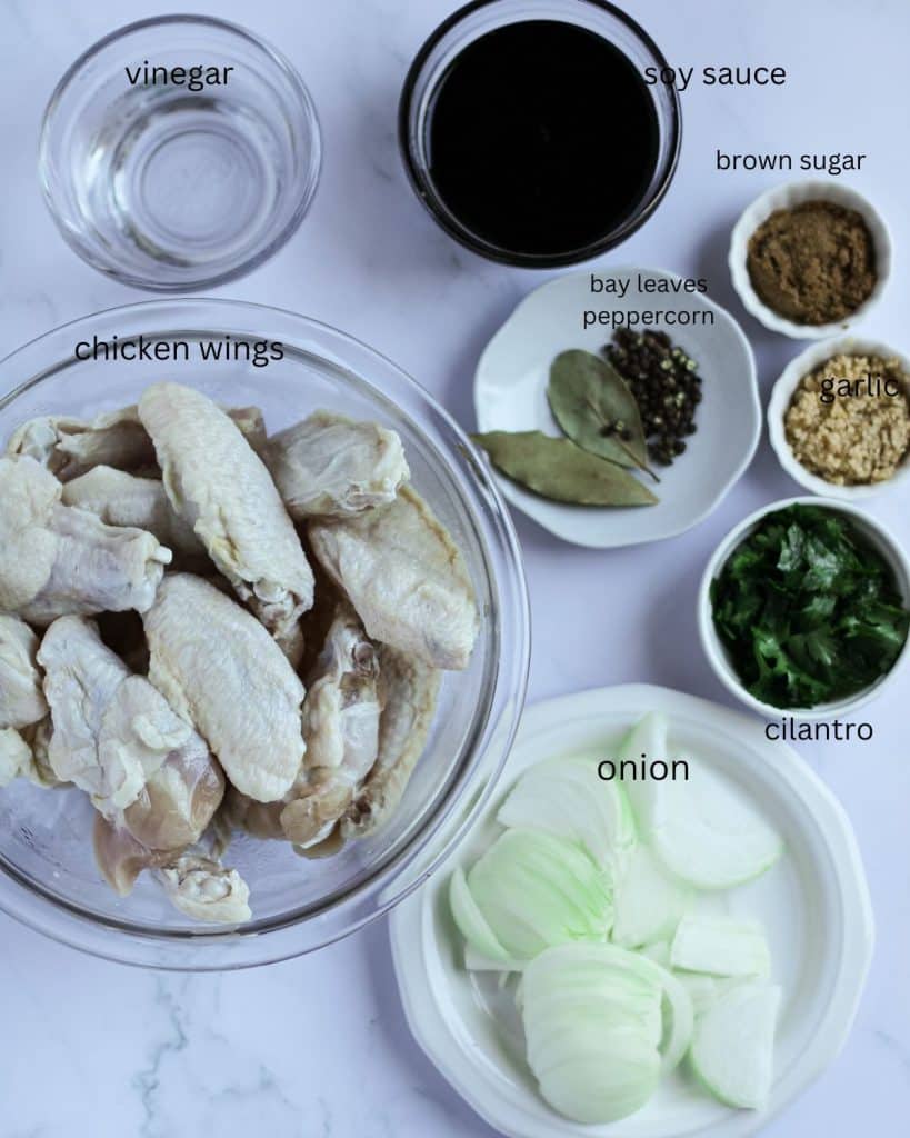 Ingredients of chicken wings adobo on the table.