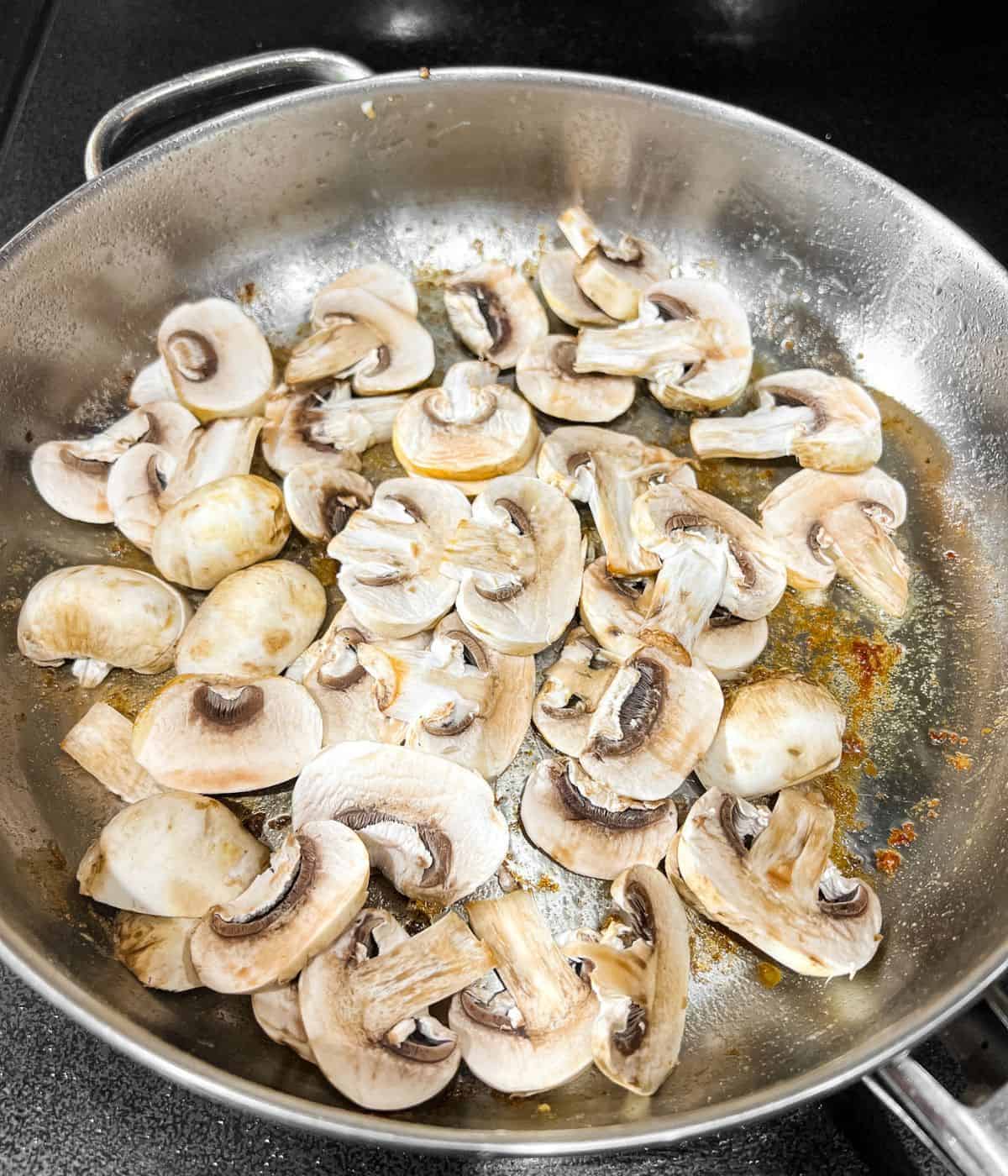 Cooking the mushrooms for chicken marsala.