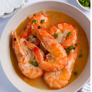 Buttered shrimp in a bowl ready to serve.