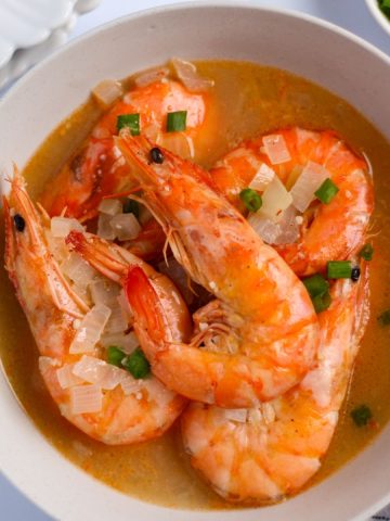 Buttered shrimp in a bowl ready to serve.
