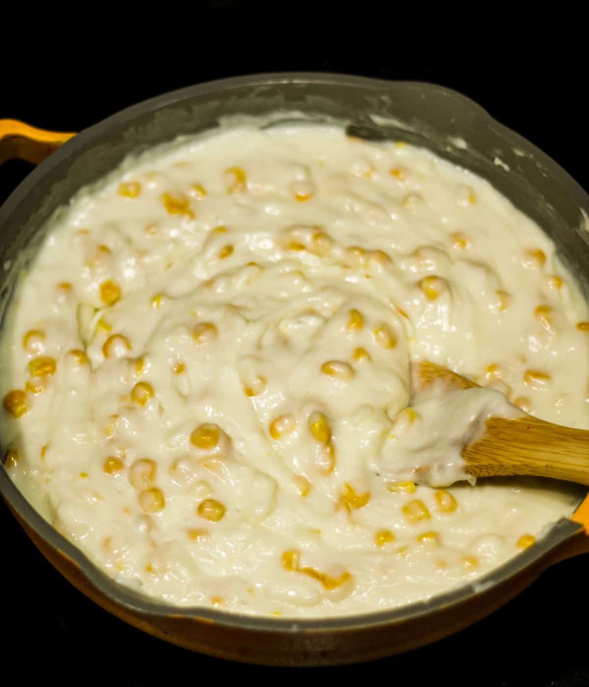 Thick maja blanca pudding in a skillet.