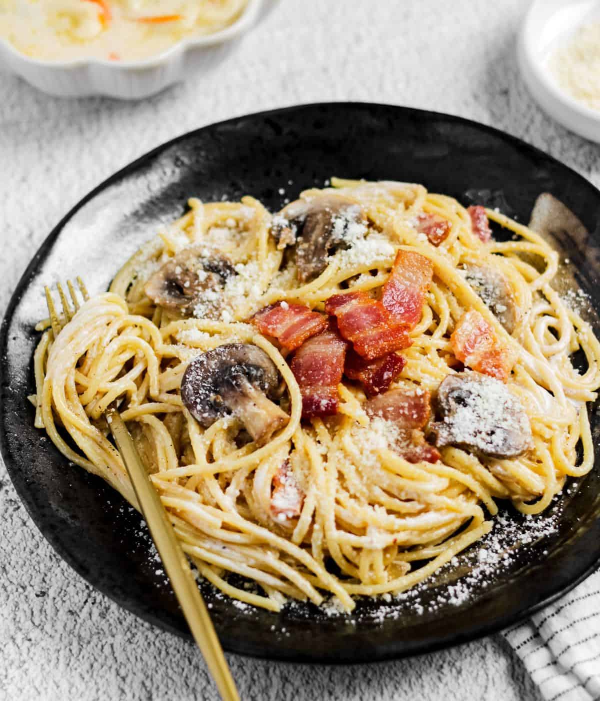 Cooked creamy carbonara on a plate.