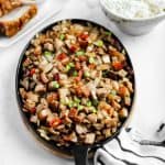Finish dish of pork belly sisig in a sizzler plate.