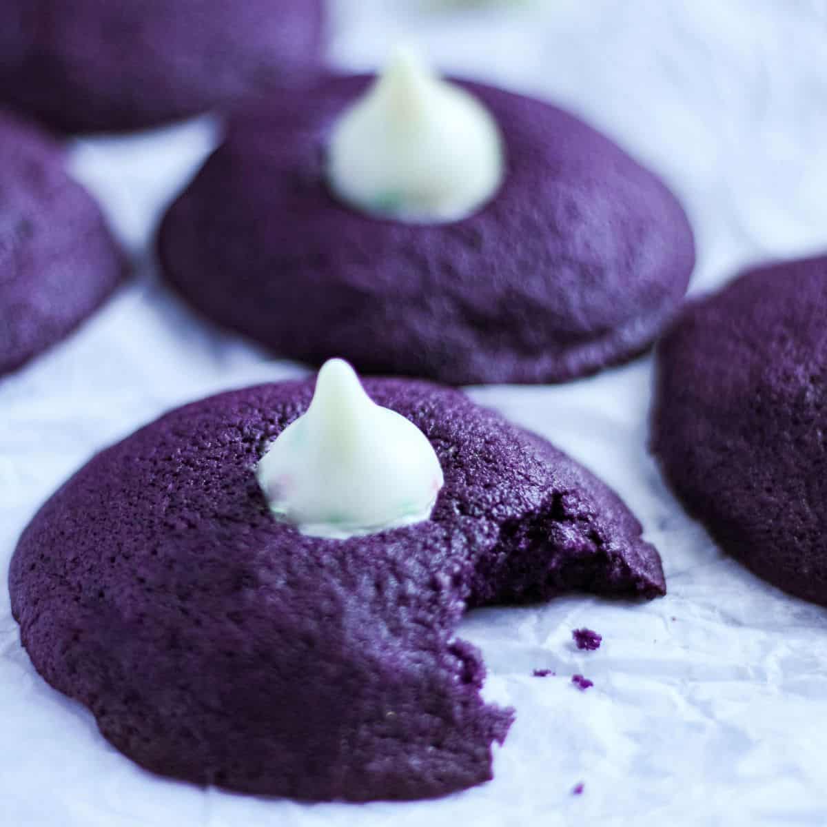 Ube cookies top with kisses chocolate on a table.