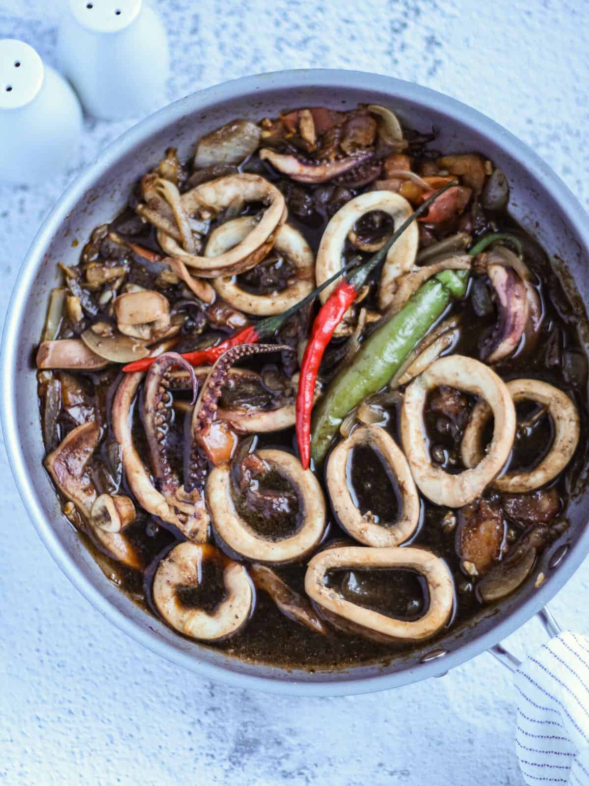 Finish dish of adobong squid in a skillet.