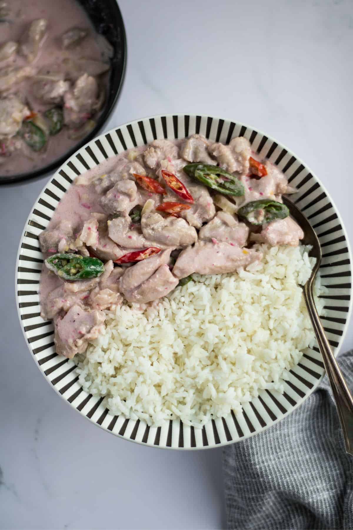 Chicken bicol express in a plate with rice.