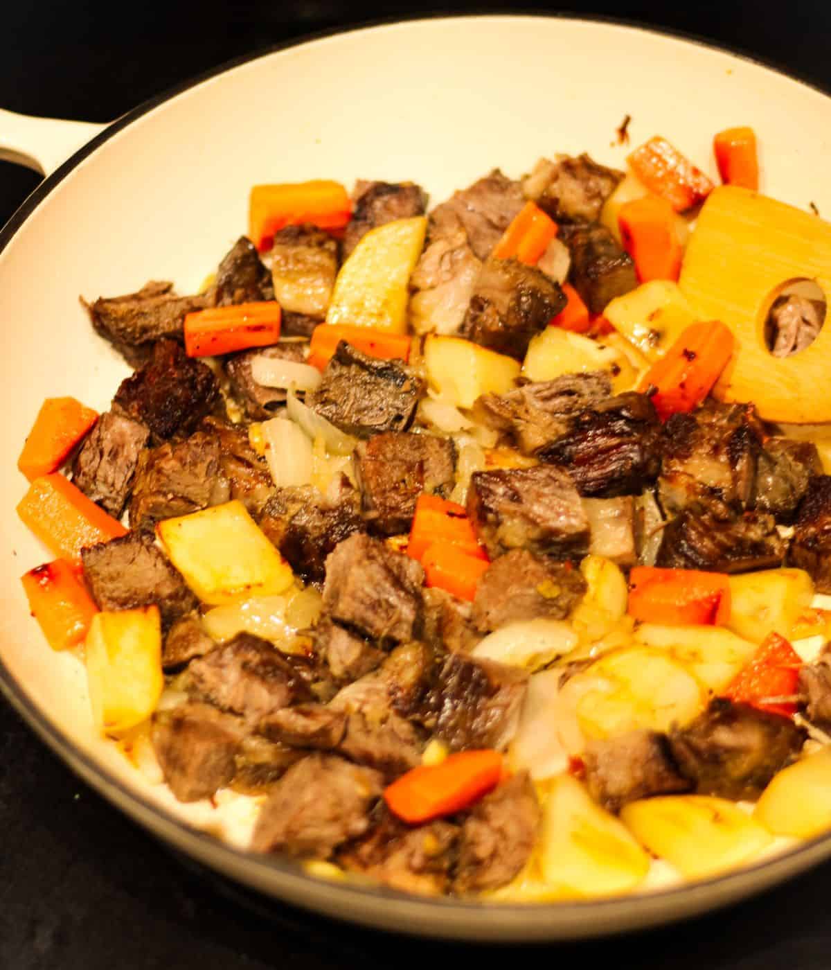 Searing beef, carrots, and potatoes for the beef curry.