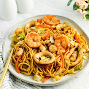 Finish dish of pancit canton with seafood on a plate.