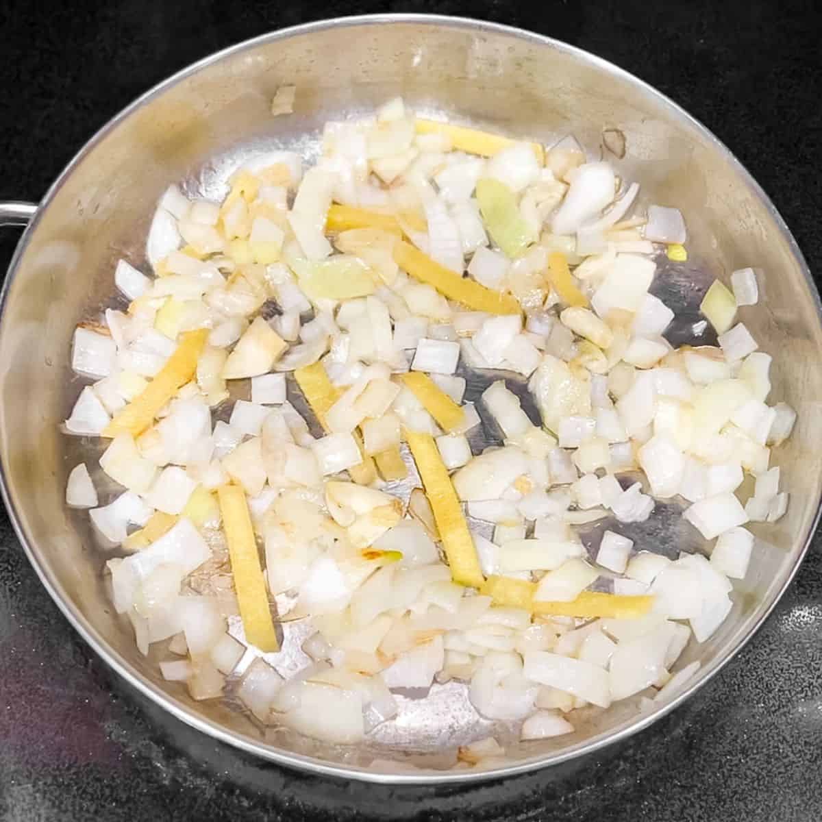 Sauted onion, garlic, and ginger in a skillet.