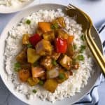 Finish dish of easy sweet and sour tofu with rice on a plate.